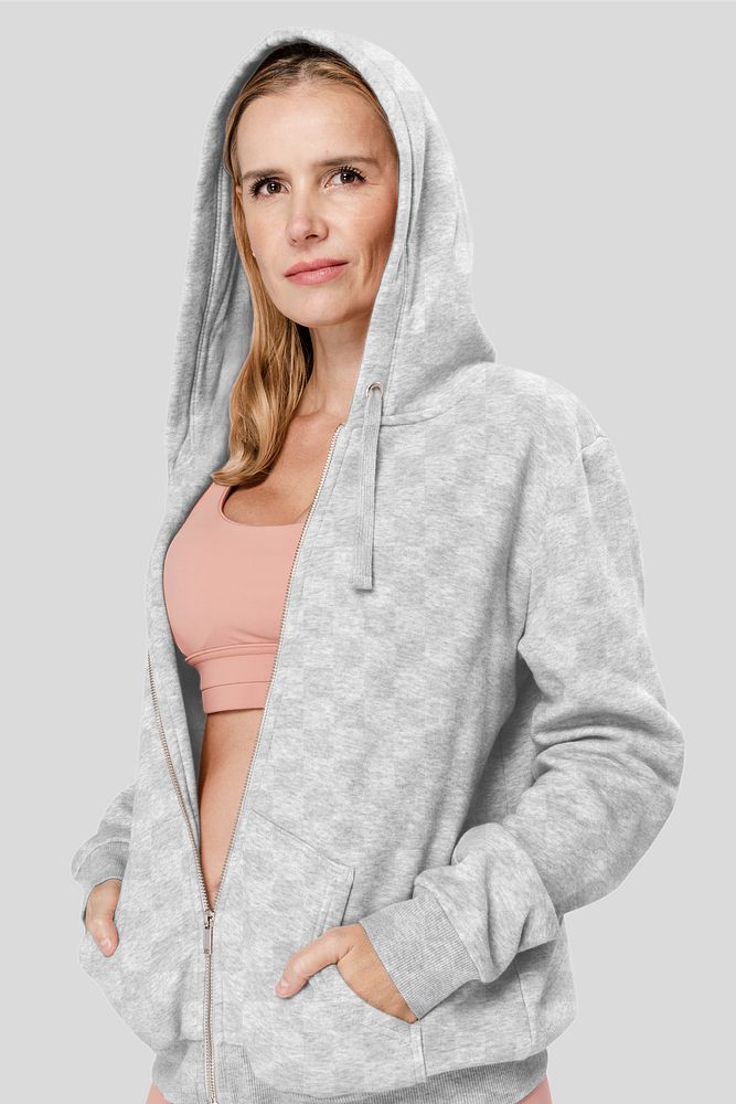 Png hoodie mockup transparent on woman with pink sports bra 