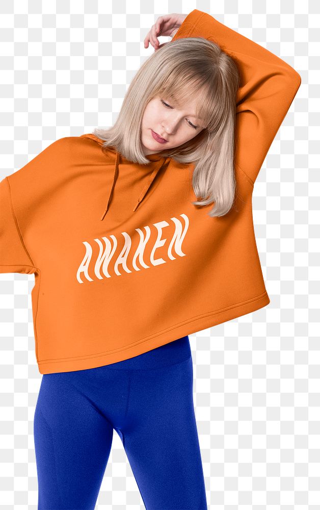 Png girl mockup in orange hoodie with printed AWAKEN typography street fashion
