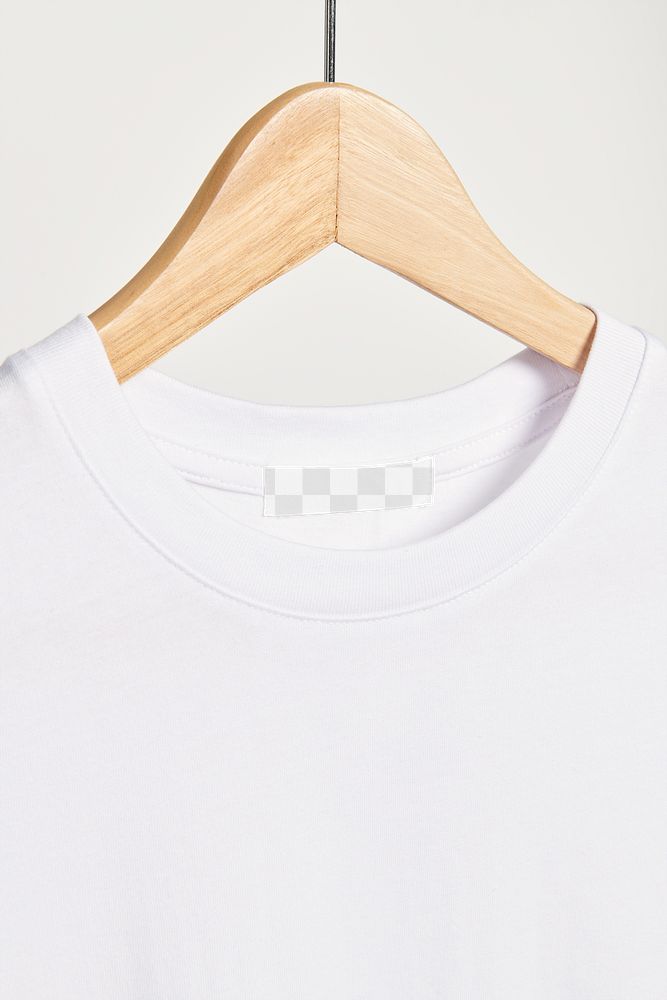 PNG white t-shirt tag mockup on a wooden hanger