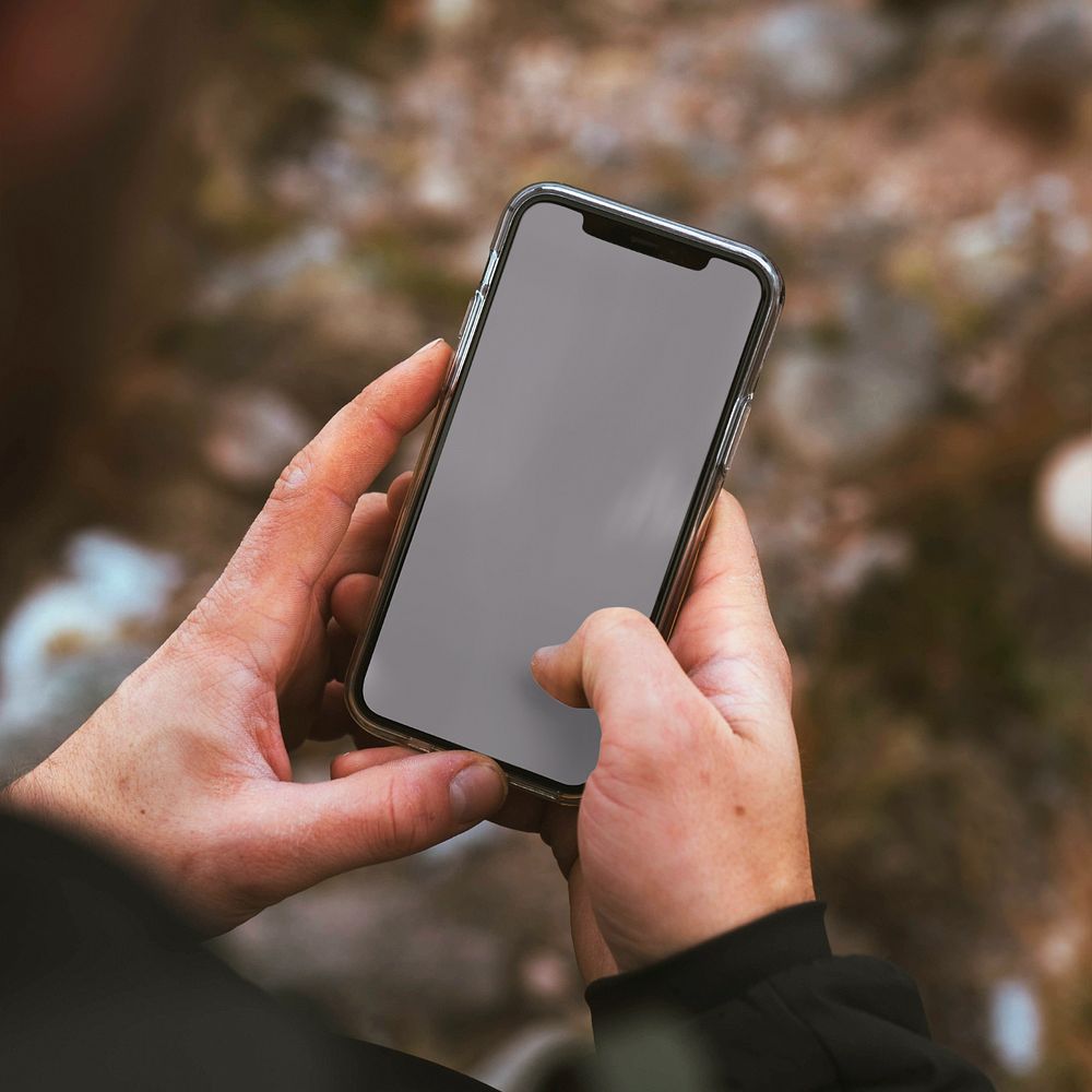 Phone screen mockup, man hands, outdoor design 