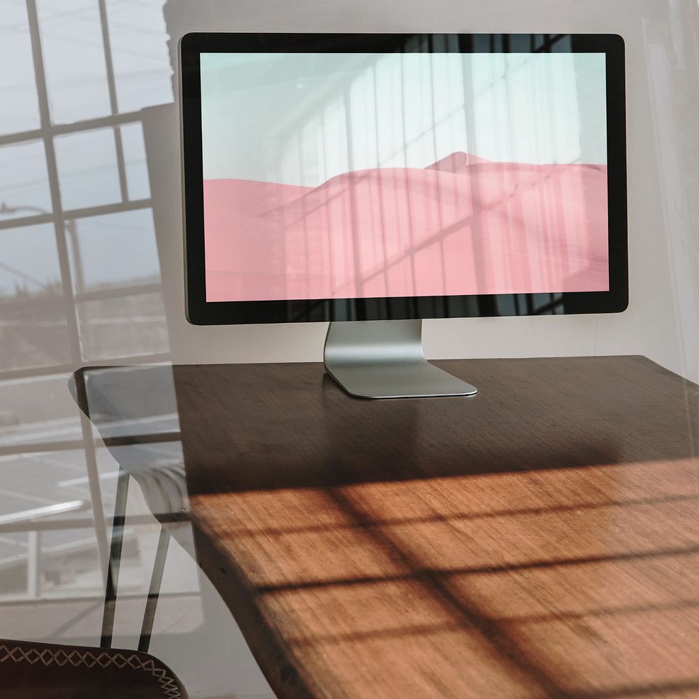 Computer screen mockup, wooden table 