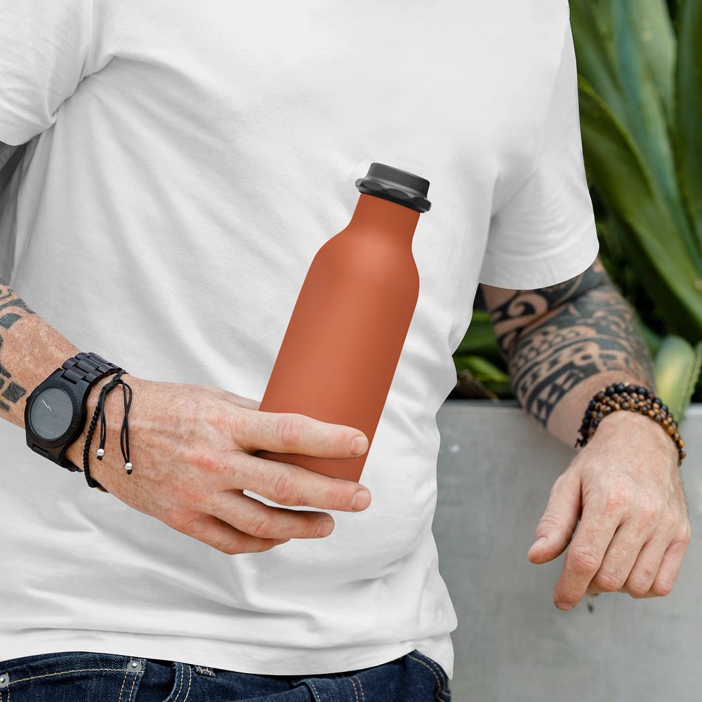 Water bottle mockup in man's hand, editable design