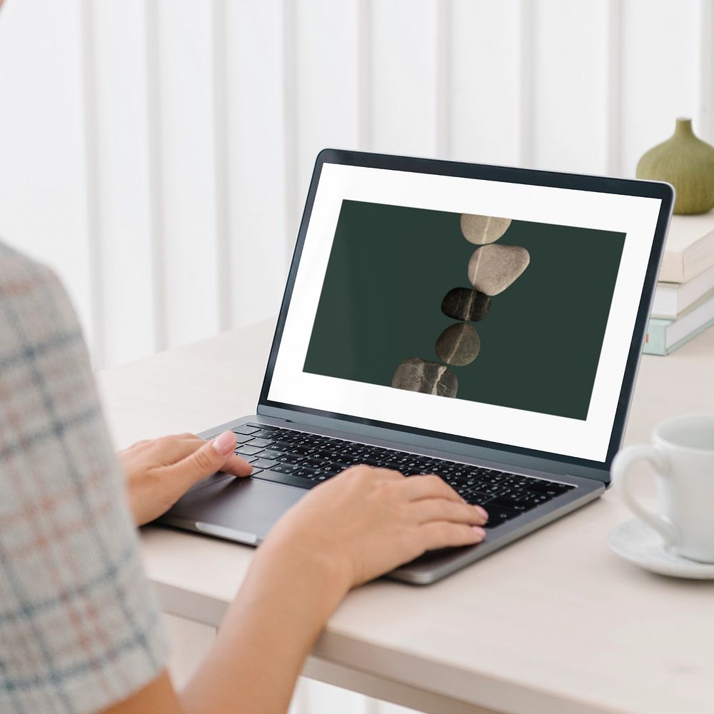 Woman using laptop mockup, editable screen