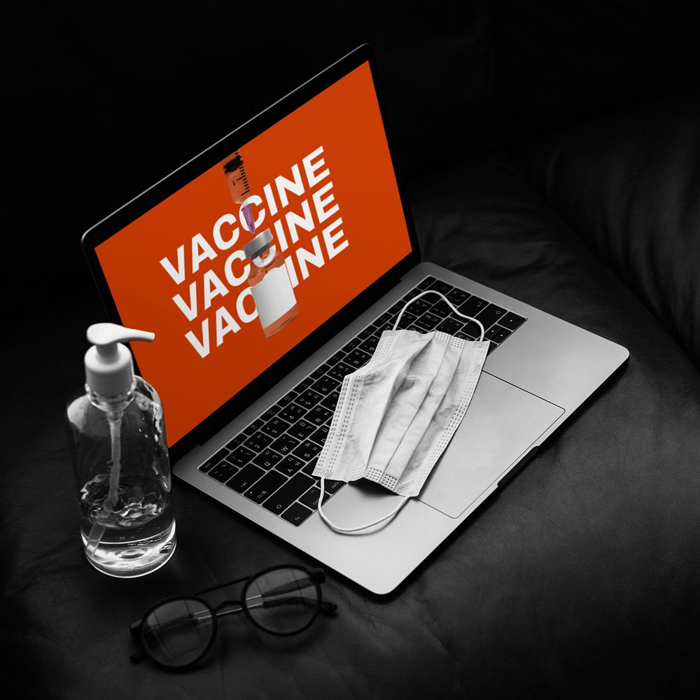 Covid vaccine on laptop mockup, customizable notebook screen