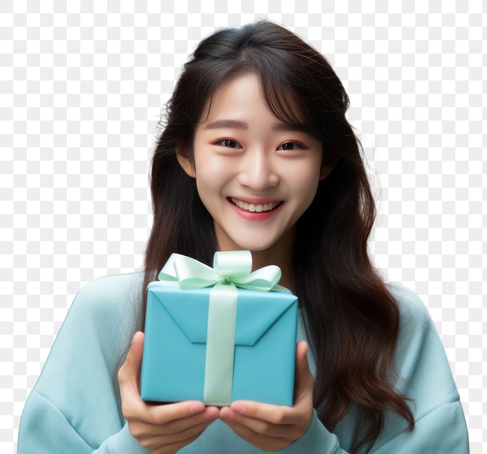 PNG Japanese girl holding a gift box looking happy and fun smile architecture celebration. AI generated Image by rawpixel.