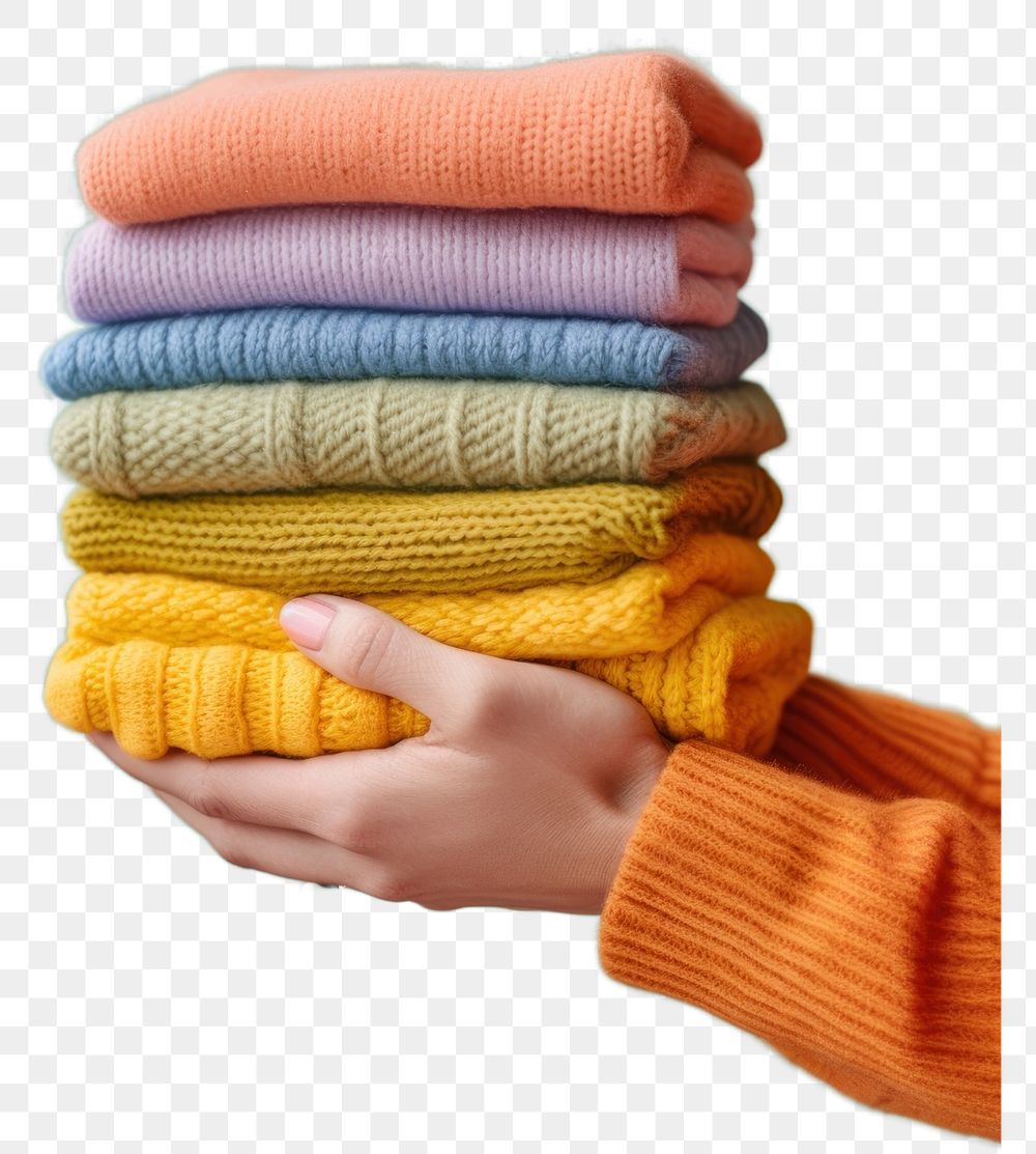 PNG Stack of folding soft handmade colorful knitted variation clothing knitwear.