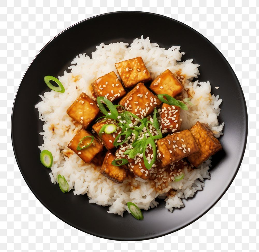 PNG  A rice and fried tofu with sesame seeds on the black plate food meat vegetable.