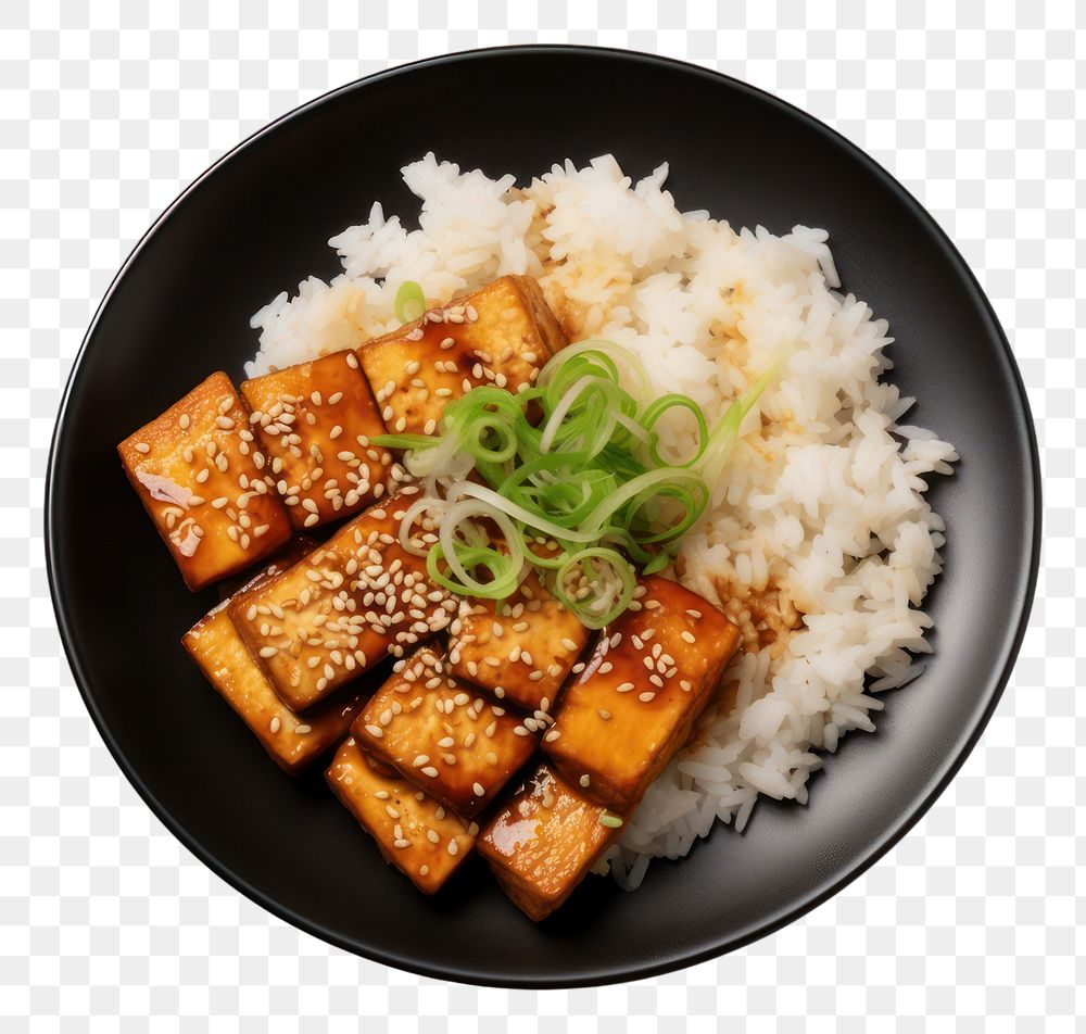 PNG  A rice and fried tofu with sesame seeds on the black plate food meat vegetable.