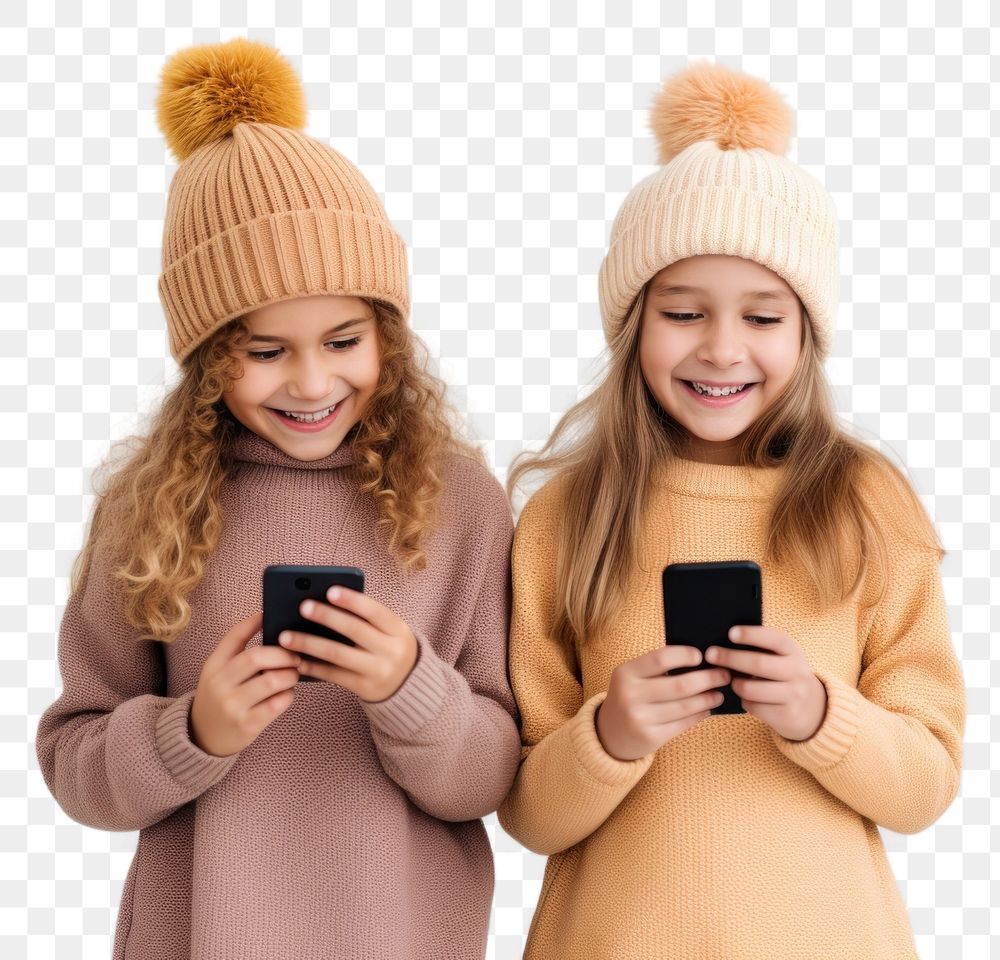 PNG  Two girls stand together while holding one phone sweater photo fun.