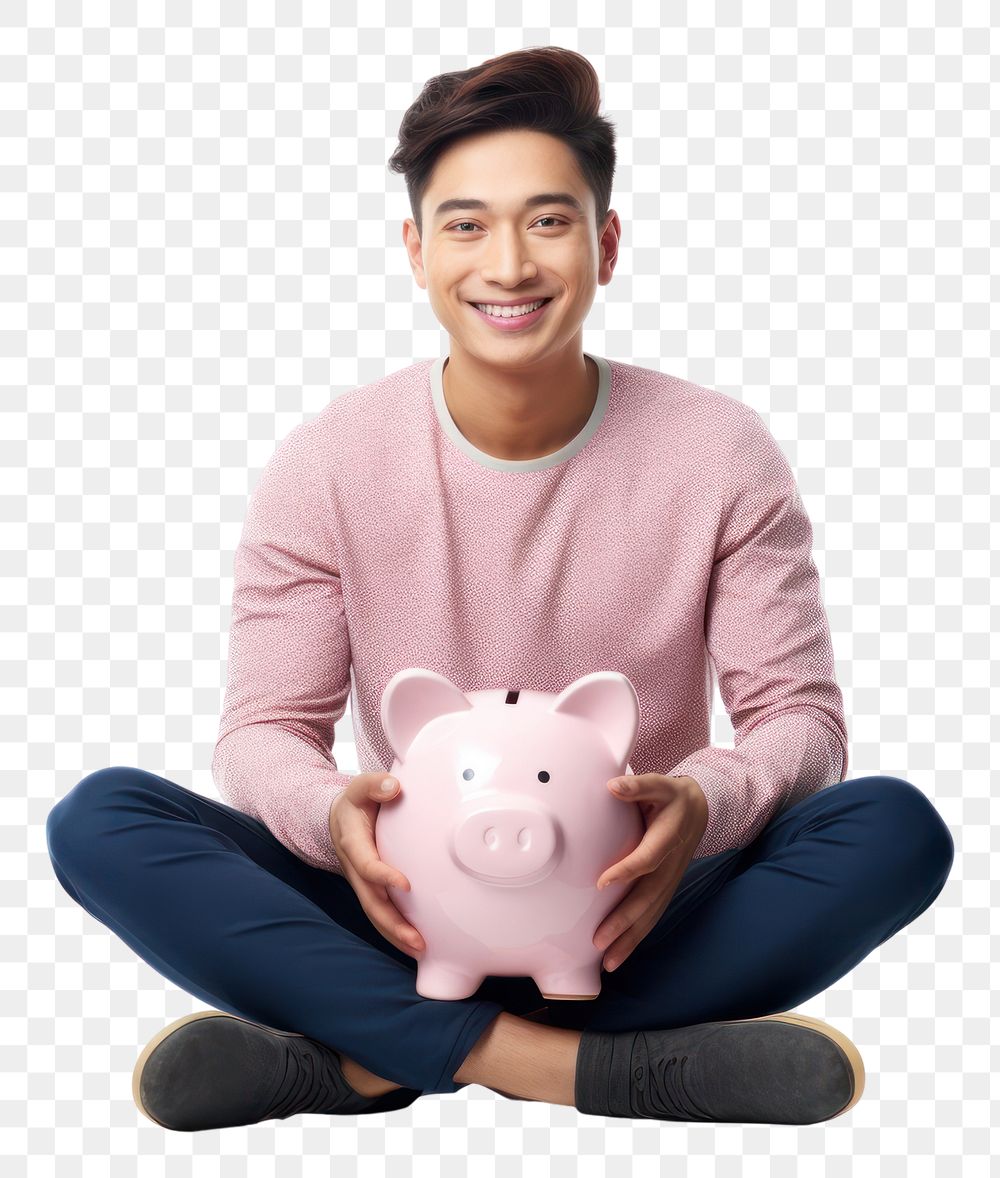 PNG Asian man smiling happily with holding pink piggy bank sitting clothing knitwear.