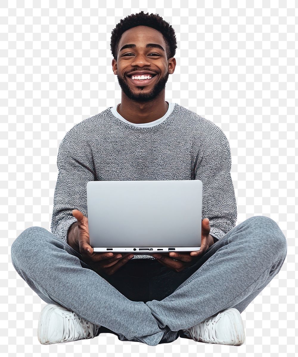 PNG Young IT African man sitting laptop happy.