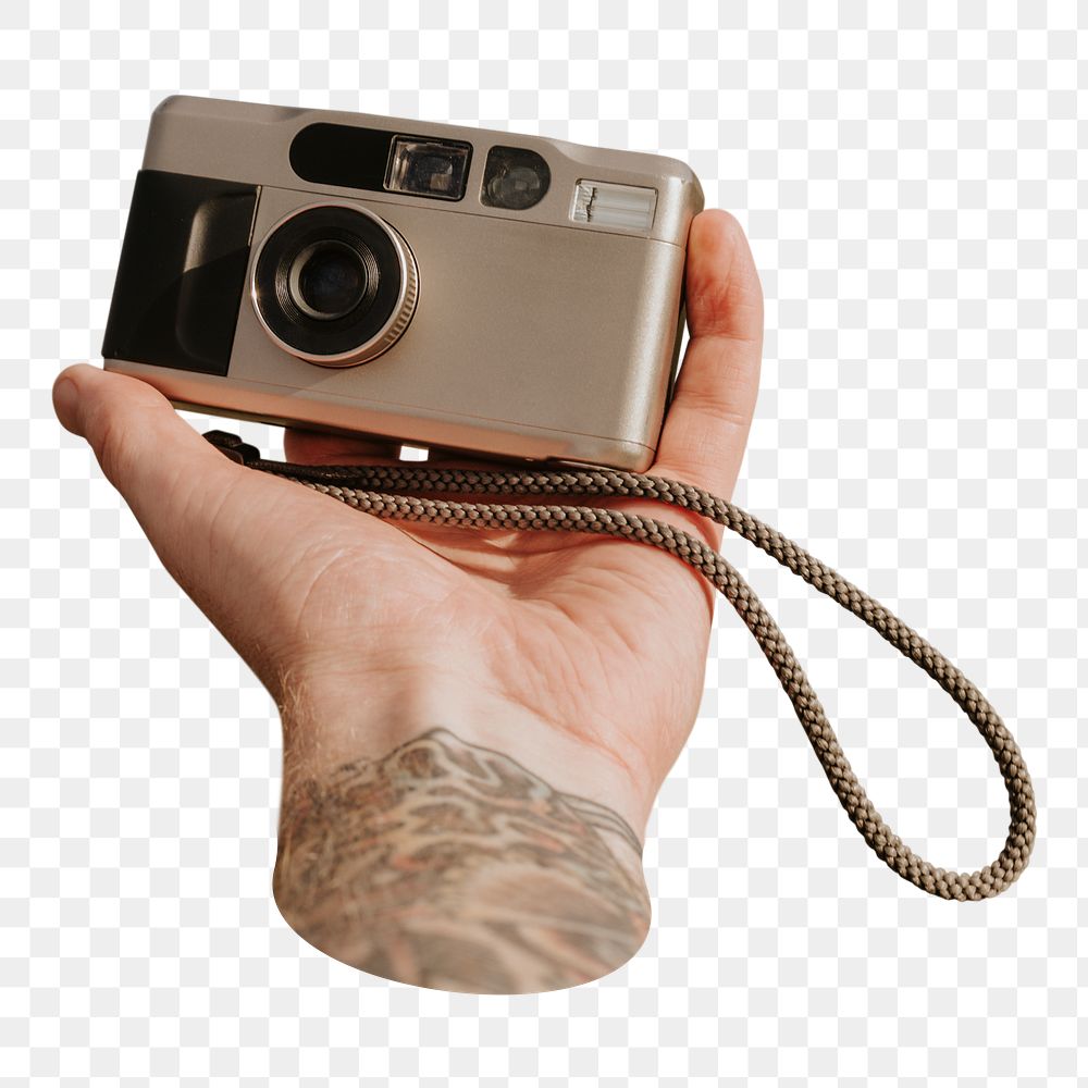 Film camera png held by tattooed photographer, transparent background