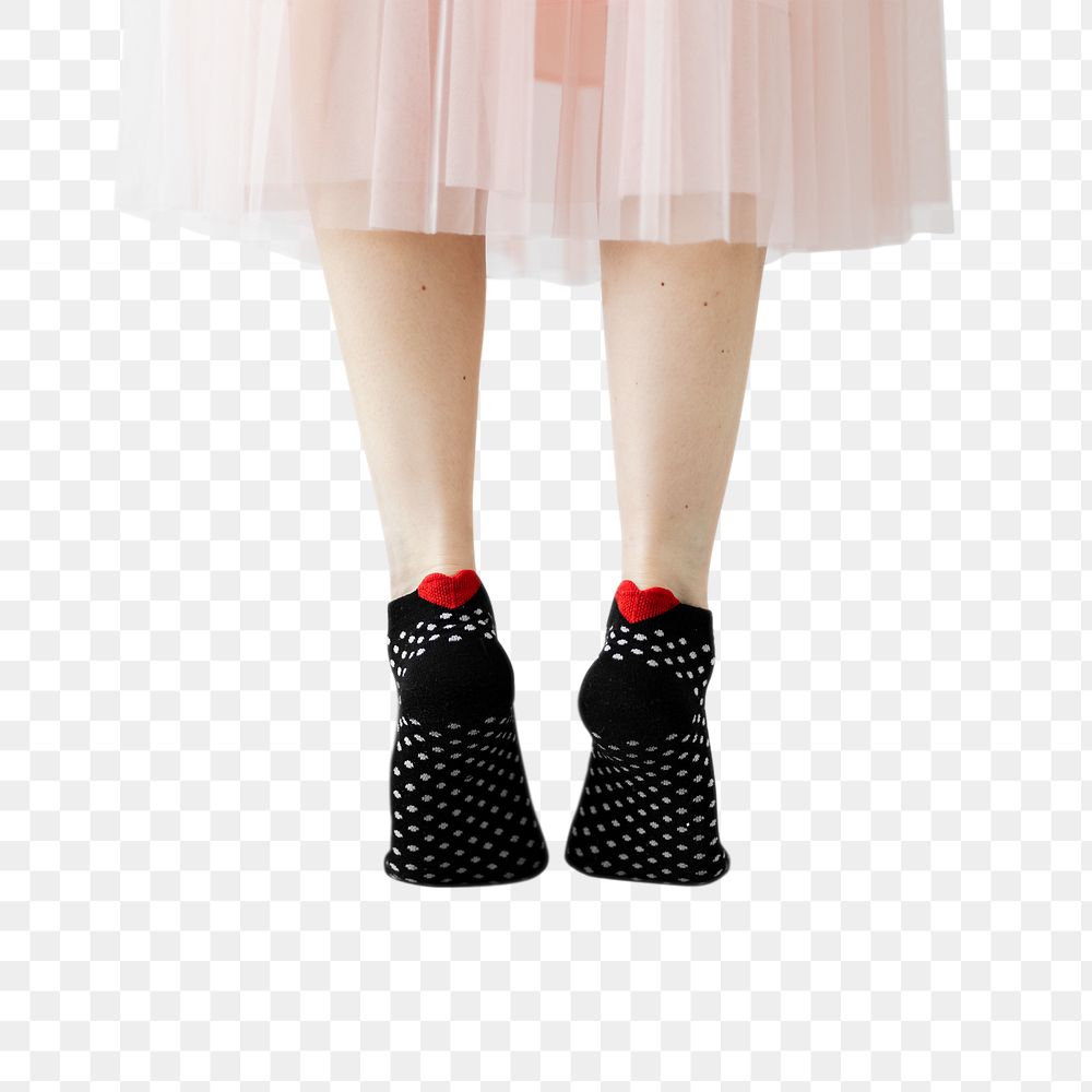 Woman in tip toes wearing black socks with hearts