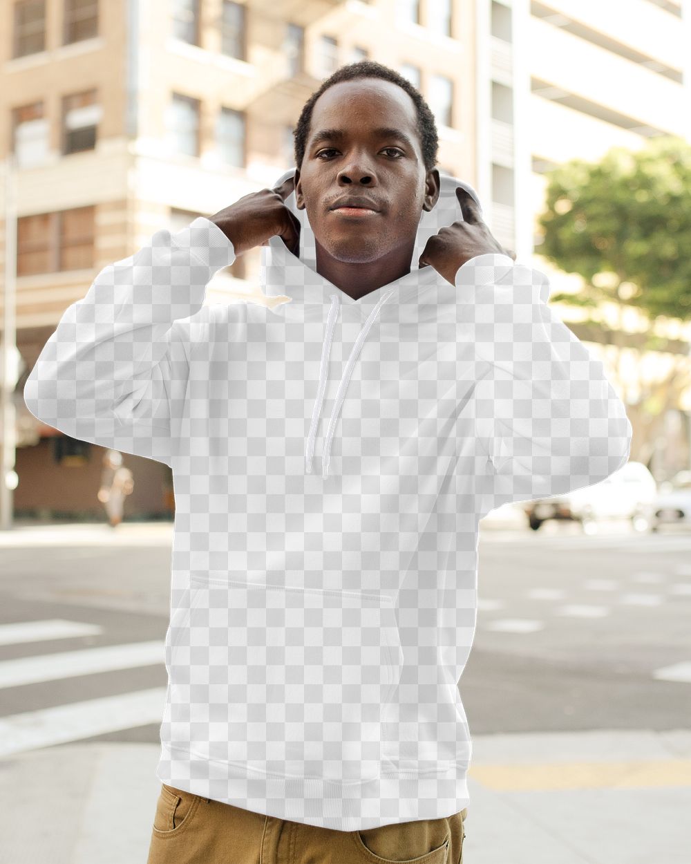 Menswear png hoodie mockup on man with brown pants in the city