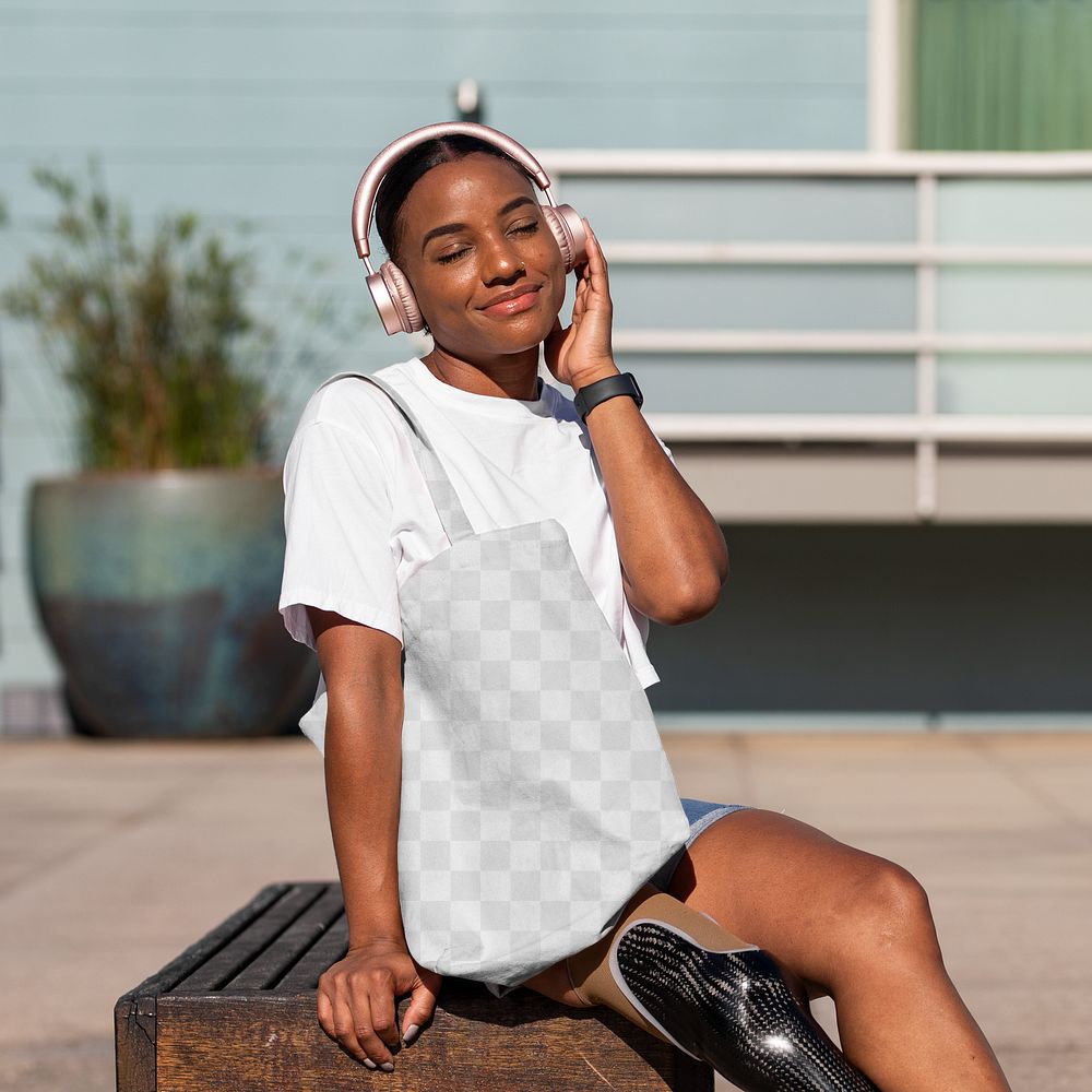 Bag mockup png, African American amputee woman listening to music