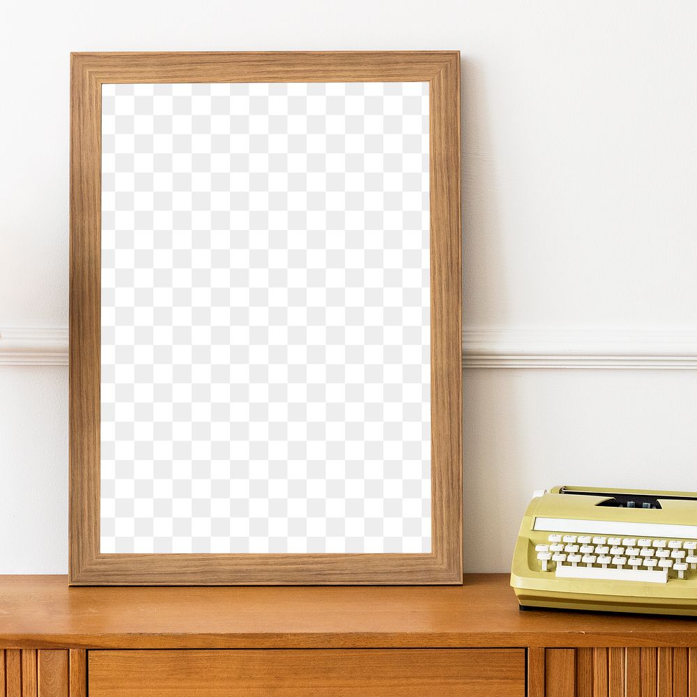 Picture frame mockup on a wooden sideboard table with a typewriter 