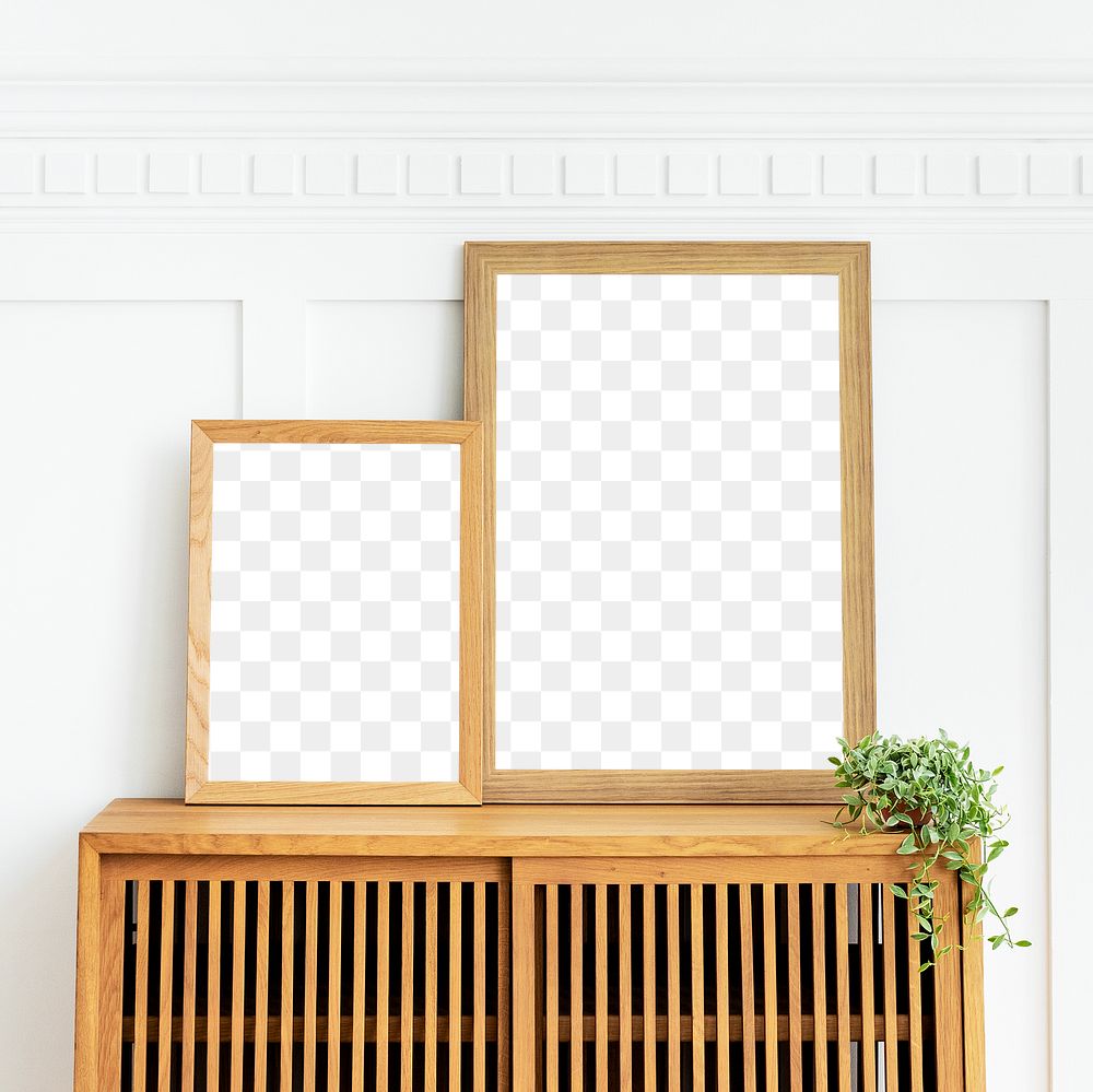 Blank picture frames on a wooden cabinet