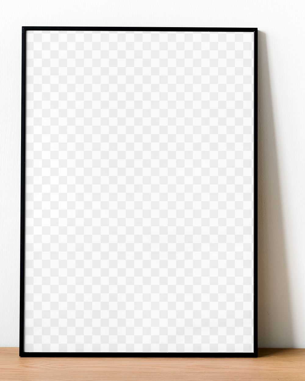 Black picture frame png mockup leaning against white wall