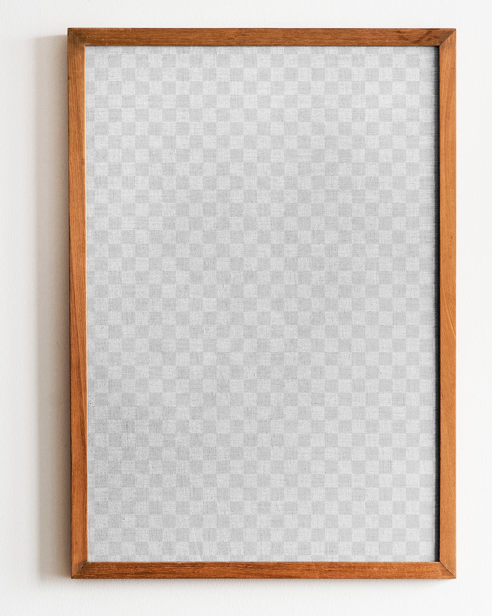 Wooden picture frame png mockup hanging on white wall