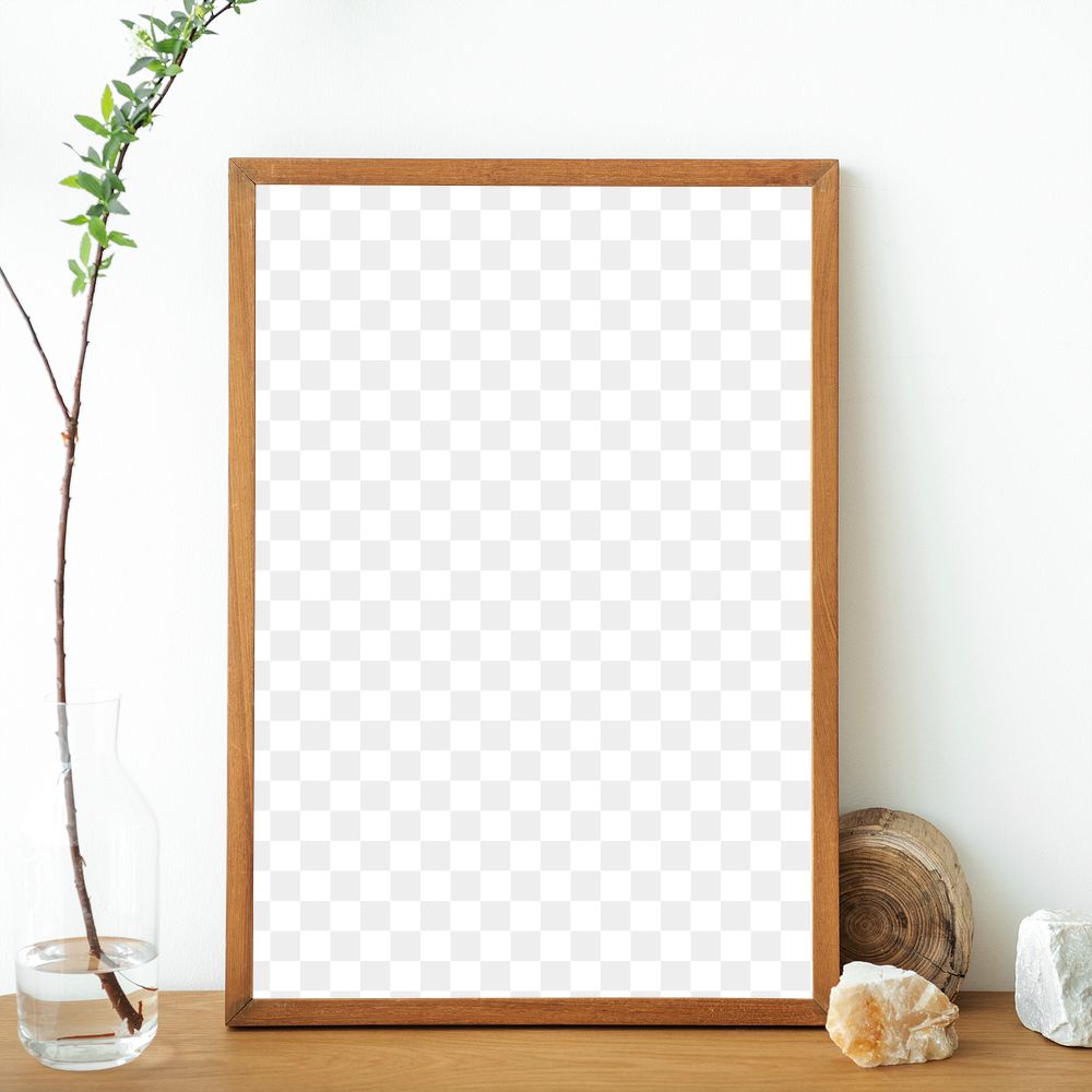 Blank wooden picture frame against a white wall design element