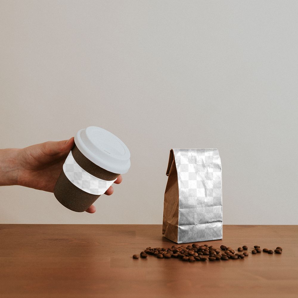 Hand holding a cork reusable cup with coffee beans design element