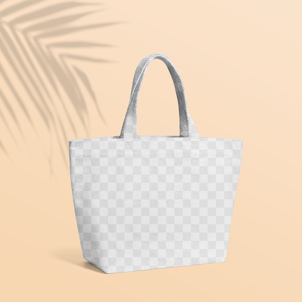 Canvas tote bag png mockup, transparent design with tropical leaf shadow