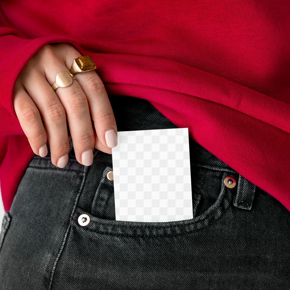 Woman keeping a card in a pocket of her jeans