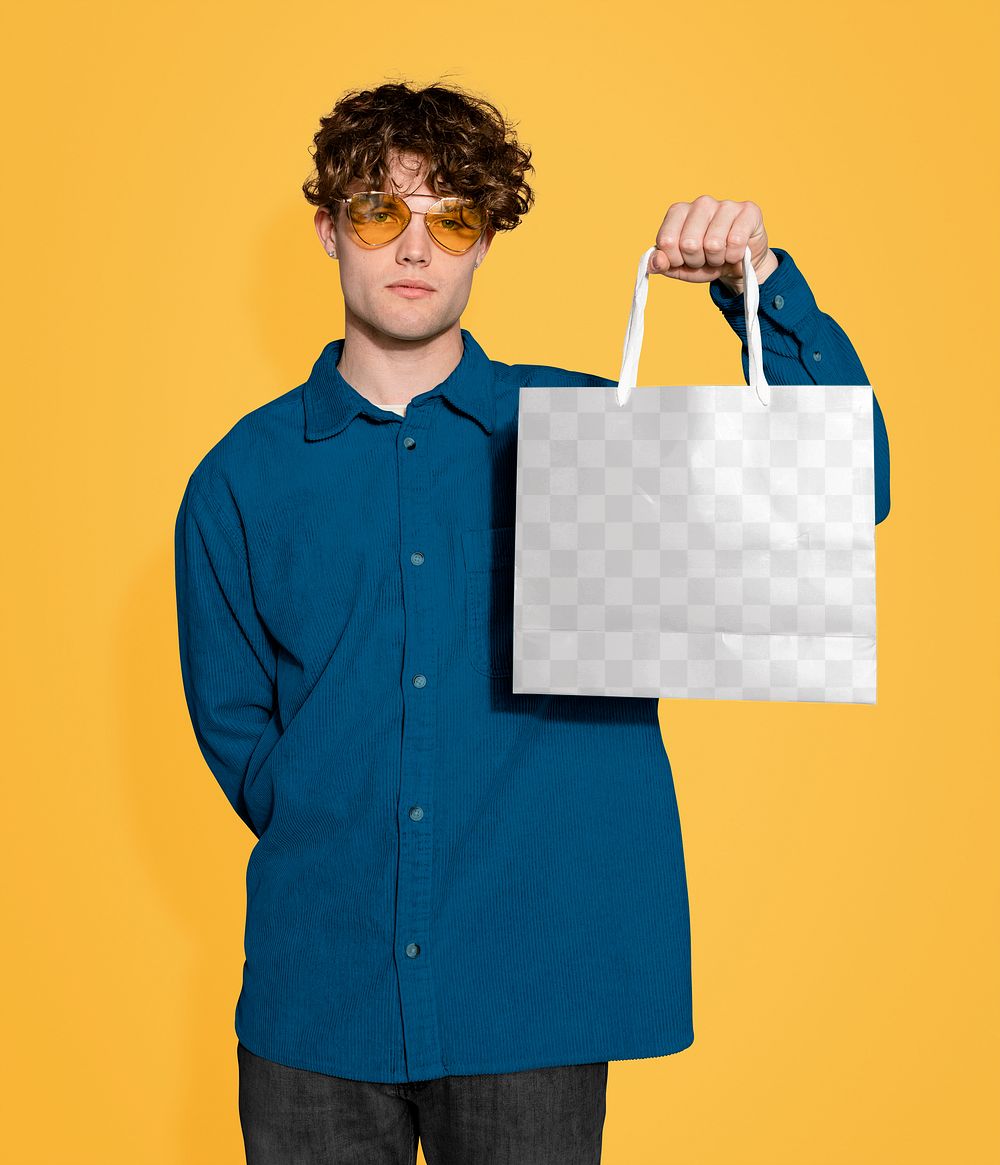 Shopping bag png mockup, stylish man holding, transparent design