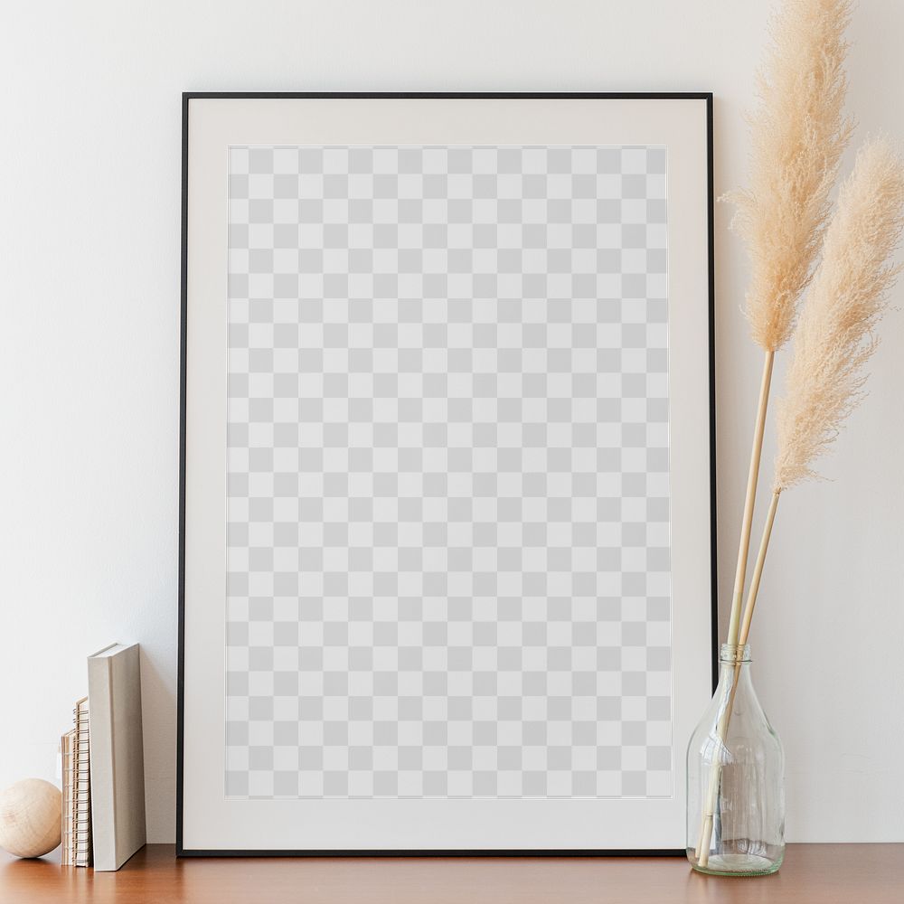 Picture frame mockup and dried pampas grass in a vase on a wooden table