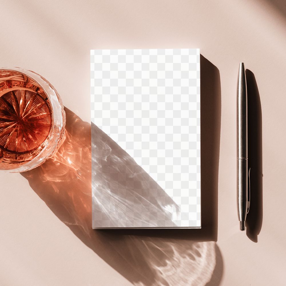 Whisky in a glass by a notepad transparent png 