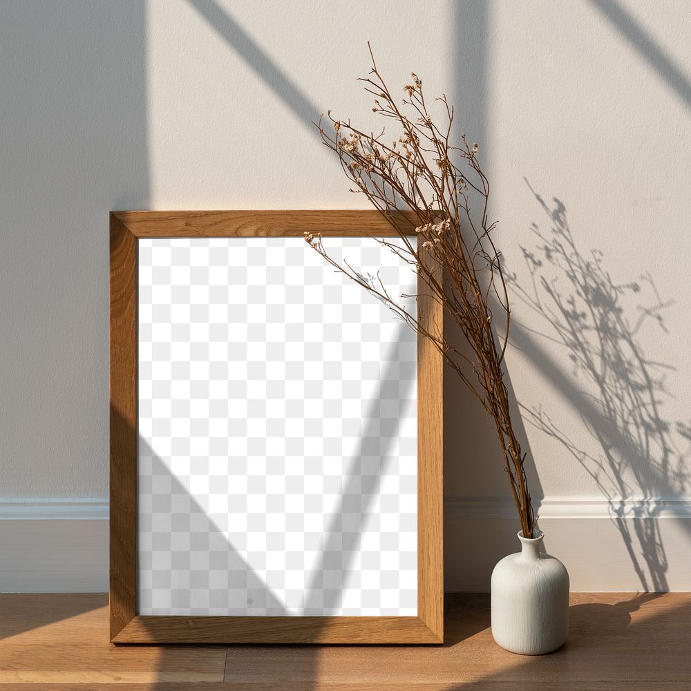 Dried white statice flower in a white vase by a wooden frame  mockup on a wooden floor