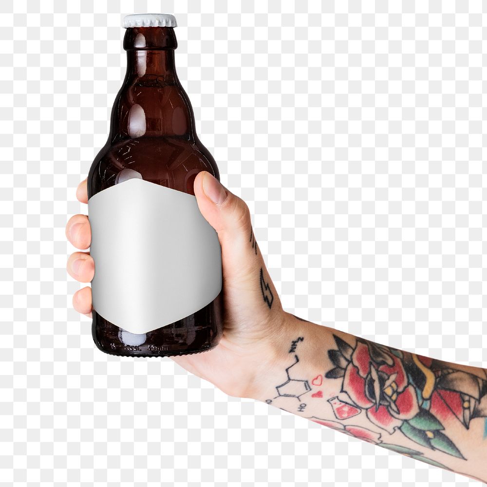 Tattooed arm holding a brown glass bottle label mockup transparent png
