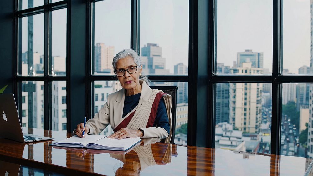 professional woman sari writes notebook | Free Video - rawpixel Download free video of A professional woman in a sari writes in a... 