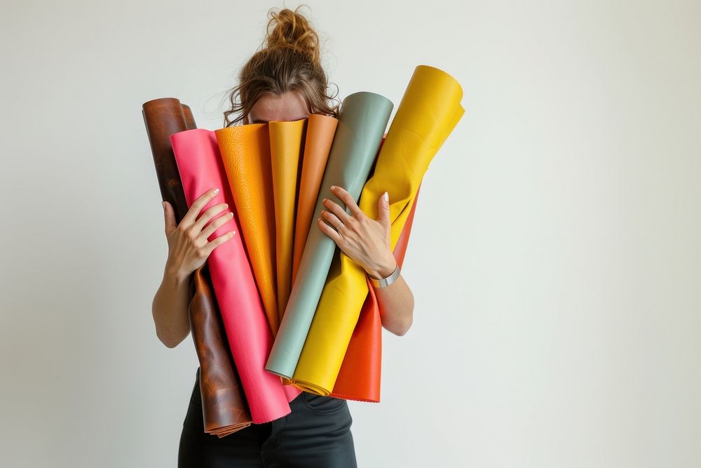 Woman holds colorful leather dynamite weaponry person.