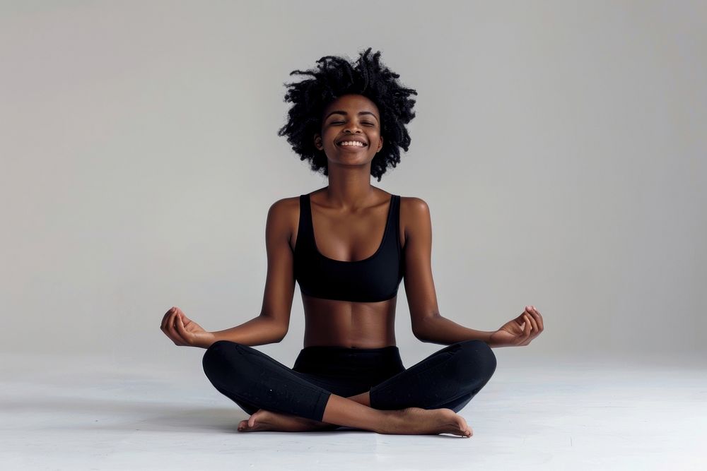 Happy black woman meditating exercise sitting fitness.