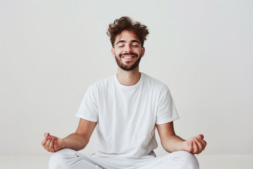 Happy man meditating exercise fitness sitting.