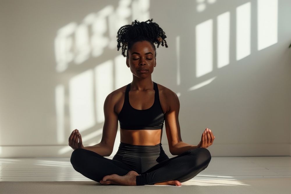 Black woman doing yoga sports exercise fitness.