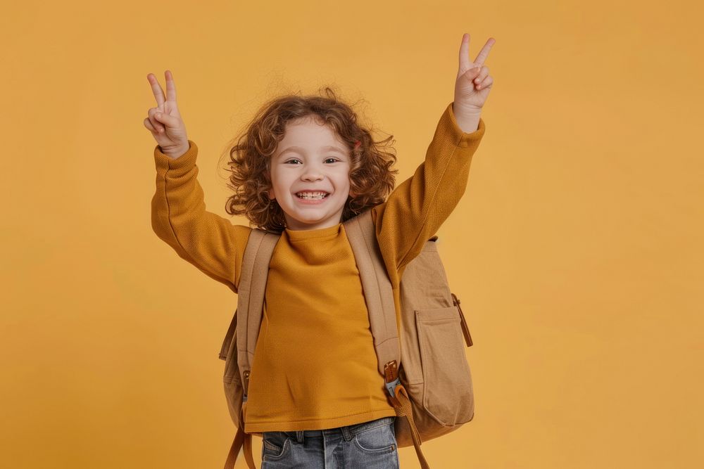 Child Raising two fingers bag accessories triumphant.