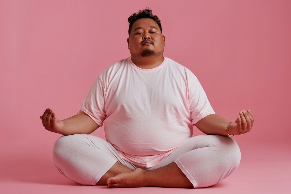 Chubby man wearing yoga exercise fitness sitting.