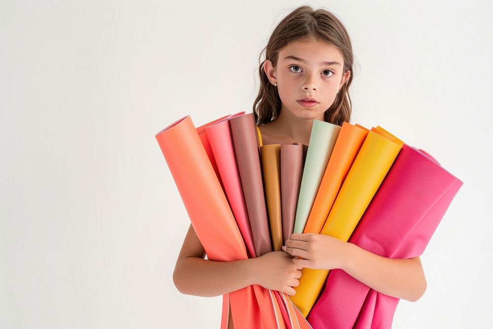 Girl holds several colorful shopping dynamite weaponry.