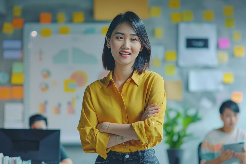 Young asian creative hipster female leader happy electronics executive.