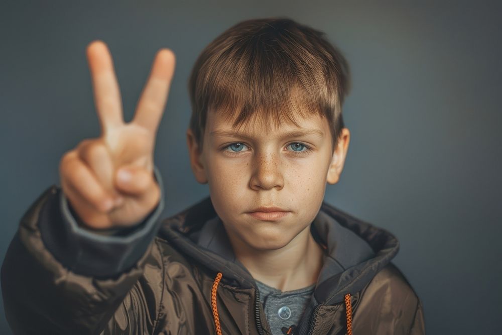 Boy raising two fingers photo hand boy.