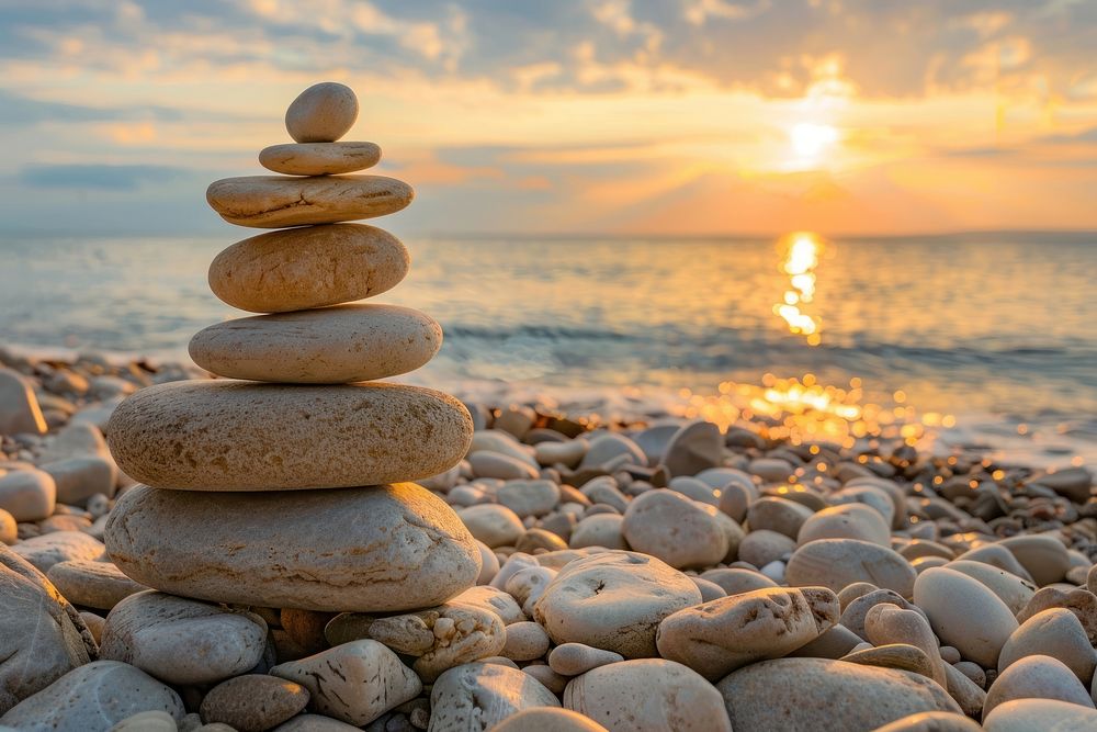 Perfect balance of stack of pebbles outdoors nature sky.