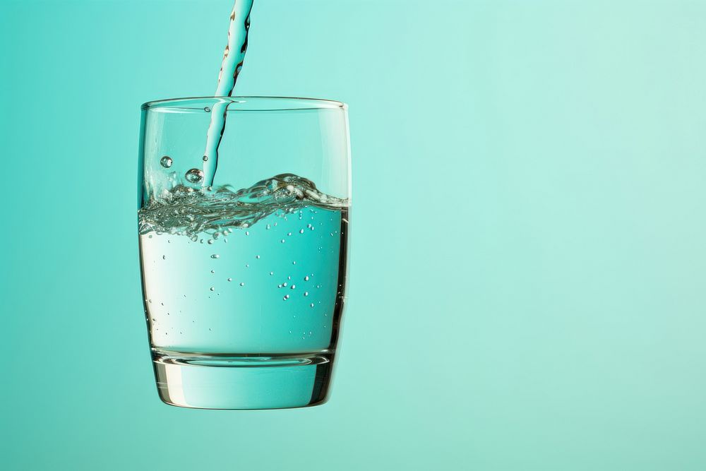 Pour water into a glass beverage drink milk.