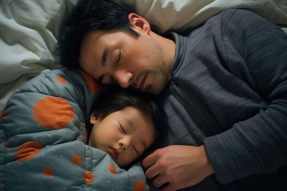 Japanese dad and baby romantic sleeping cuddling.