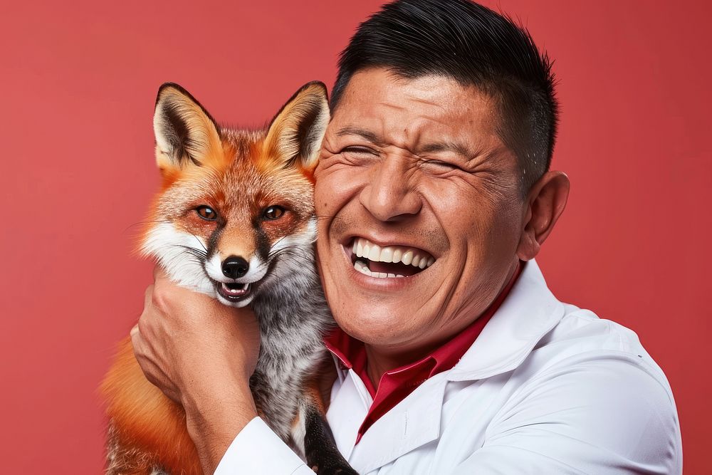 Hispanic man holding fox laughing wildlife person.