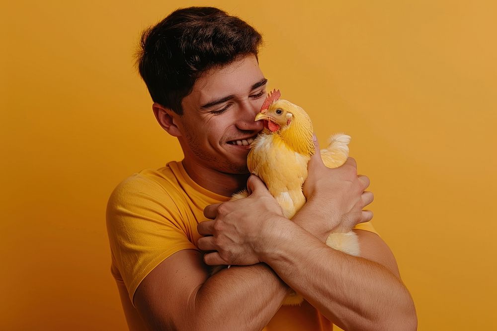 Hispanic man hug chicken person biting human.