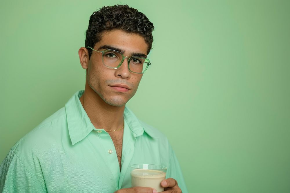 Hispanic men holding cup coffee portrait photography accessories.