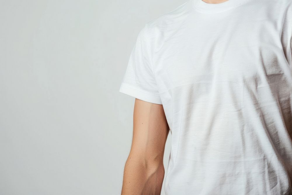 Patient in white t-shirt with little plasters on crook of arm clothing apparel sleeve.