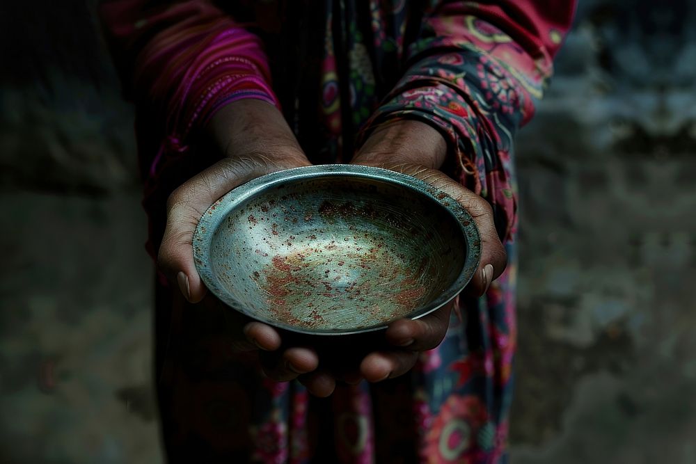 Poverty hands holding a dish cookware female person.
